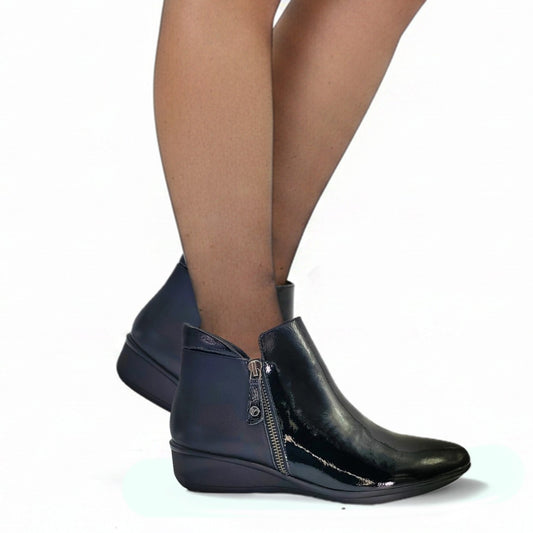 Lifestyle image for Damascus Wedged Boot - Black Patent