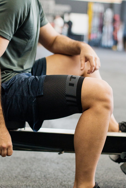 Lifestyle image for QS4 Thigh Brace Compression Sleeve - Black